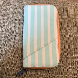 Mint green, pale orange and white travel wallet, passport wallet